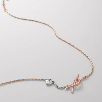 Fossil Rose Bow and Arrow Necklace