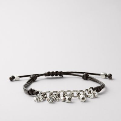   tone chain highlight the shining crystal details of this wrist wrap